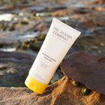 The Jojoba Company Australian Jojoba Aqua Gel tube on a rock by the ocean