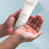The Jojoba Company Citrus Gel Cleanser with a dollop on the palm