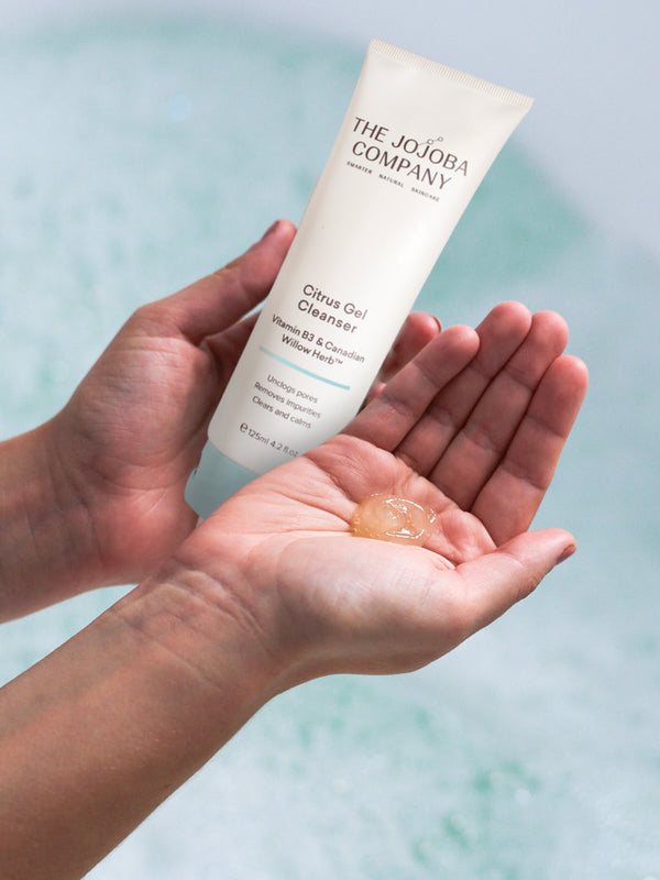 The Jojoba Company Citrus Gel Cleanser with a dollop on the palm