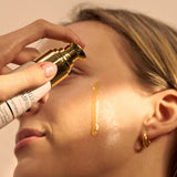 Applying The Jojoba Company Pigmentation Oil to the face