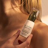 Holding a bottle of The Jojoba Company Pigmentation Oil