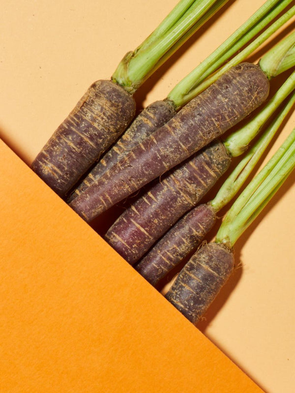 Fresh purple carrots, a key ingredient in Andalou Brightening Purple Carrot + Vitamin C Luminous Night Cream