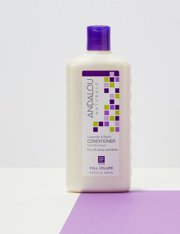 Andalou Naturals Full Volume Lavender & Biotin Conditioner styled on a lavender background