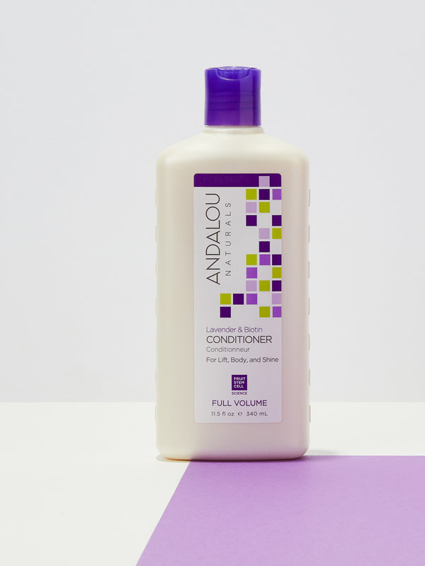 Andalou Naturals Full Volume Lavender & Biotin Conditioner styled on a lavender background