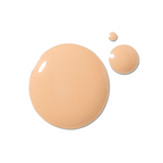 A peach-beige 100% Pure 2nd Skin Serum Foundation swatch forms one large glossy circle, with two smaller round drops above and to the right.