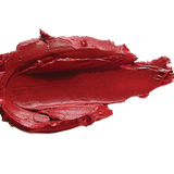 A thick smear of deep warm red Blood Orange matte lipstick on white, with a smooth centre and raised, creamy ridges around the edges.