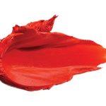 A thick smear of vivid orange red Cactus Bloom matte lipstick on white, with a smooth centre and raised, creamy ridges around the edges.