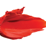 A thick smear of vivid orange red Cactus Bloom matte lipstick on white, with a smooth centre and raised, creamy ridges around the edges.