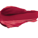 A thick smear of deep crimson red Currant matte lipstick on white, with a smooth centre and raised, creamy ridges around the edges.