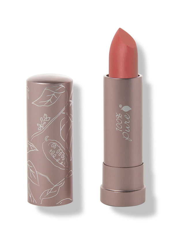 100% Pure Mirage matte lipstick with a slanted muted coral pink tip extended from a taupe tube; its matching cap stands beside it with white botanical line drawings.