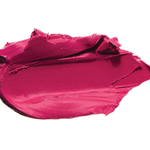 A thick smear of vivid fuchsia pink Marrakesh matte lipstick on white, with a smooth centre and raised, creamy ridges around the edges.
