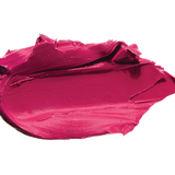 A thick smear of vivid fuchsia pink Marrakesh matte lipstick on white, with a smooth centre and raised, creamy ridges around the edges.