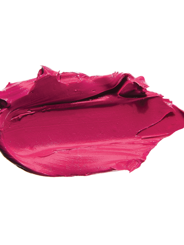 A thick smear of vivid fuchsia pink Marrakesh matte lipstick on white, with a smooth centre and raised, creamy ridges around the edges.