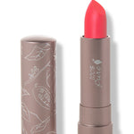100% Pure Prickly Pear matte lipstick with a slanted bright coral pink tip extended from a taupe tube; its matching cap stands beside it with white botanical line drawings.