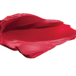 A thick smear of raspberry pink Protea matte lipstick on white, with a smooth centre and raised, creamy ridges around the edges.