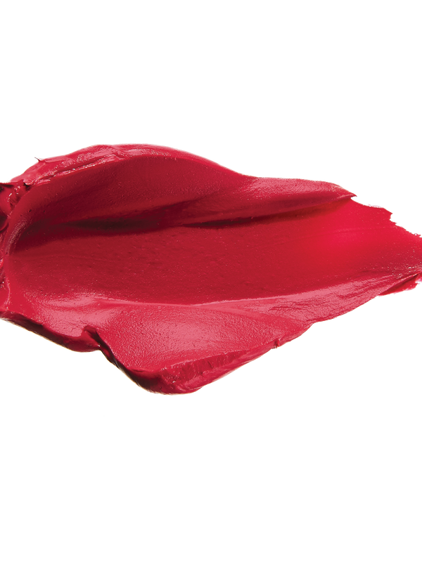A thick smear of raspberry pink Protea matte lipstick on white, with a smooth centre and raised, creamy ridges around the edges.
