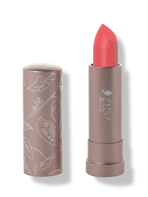 100% Pure Strawberry Cactus matte lipstick with a slanted bright coral red tip extended from a taupe tube; its matching cap stands beside it with white botanical line drawings.