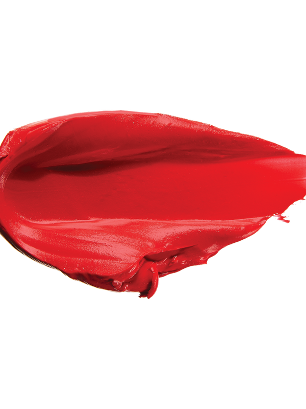 A thick smear of bright scarlet red Sonora matte lipstick on white, with a smooth centre and raised, creamy ridges around the edges.