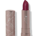 100% Pure Winecup matte lipstick with a slanted deep berry red tip extended from a taupe tube; its matching cap stands beside it with white botanical line drawings.