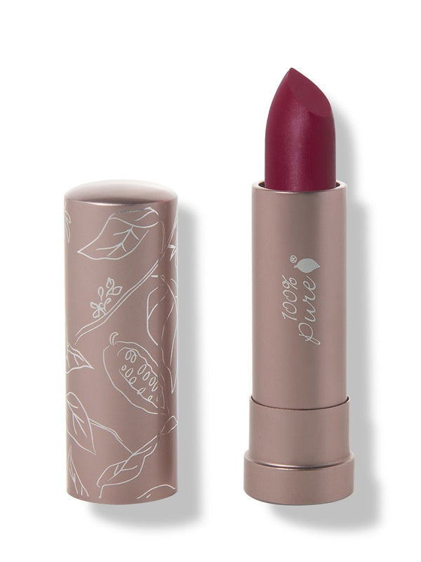 100% Pure Winecup matte lipstick with a slanted deep berry red tip extended from a taupe tube; its matching cap stands beside it with white botanical line drawings.