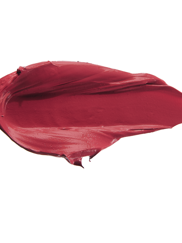A thick smear of deep berry red Winecup matte lipstick on white, with a smooth centre and raised, creamy ridges around the edges.