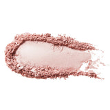 A swatch of Moonstone Glow luminiser with an almost white, pearly pink centre surrounded by loose dusty pink powder on white.