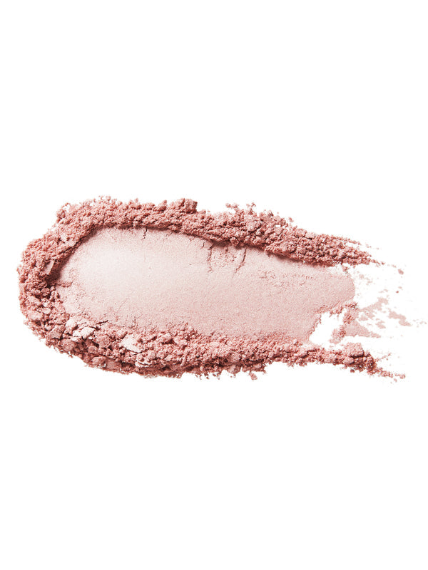 A swatch of Moonstone Glow luminiser with an almost white, pearly pink centre surrounded by loose dusty pink powder on white.