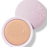 An open pale pink compact of Copper Gold luminiser, showing warm golden powder embossed with the 100% Pure logo and a matching patterned lid behind it.