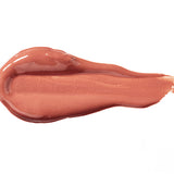 Butterchew 100% Pure Lip Caramel swatch: thick, glossy warm rose-brown liquid lipstick spread into an elongated smear, with raised ridges and a tapering streak at one end.