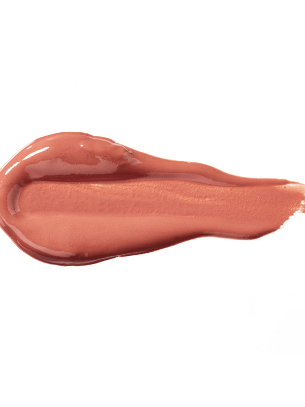 Butterchew 100% Pure Lip Caramel swatch: thick, glossy warm rose-brown liquid lipstick spread into an elongated smear, with raised ridges and a tapering streak at one end.
