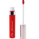 100% Pure Lip Caramel in Red Velvet: an open clear tube of rich red liquid lipstick beside a white applicator wand with a reflective silver-pink cap and a tip coated in the same shade.