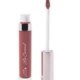 100% Pure Lip Caramel in Truffle: an open clear tube of mauve-brown liquid lipstick beside a white applicator wand with a reflective silver-pink cap and a tip coated in the same shade.