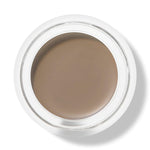 Top view of an open white pot of 100% Pure Long Last Brows in Blonde, showing a smooth, flat surface of light taupe-brown brow cream.