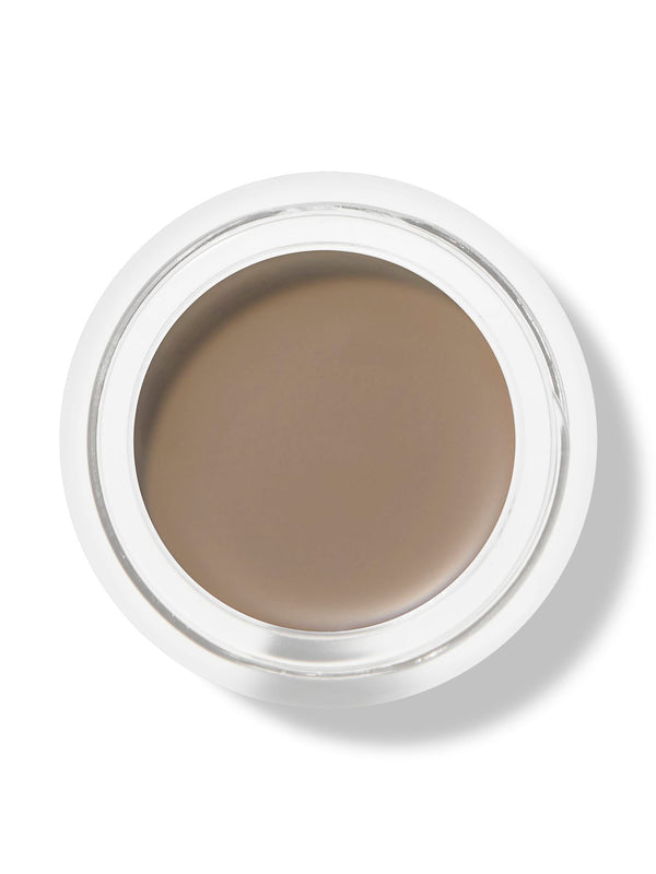 Top view of an open white pot of 100% Pure Long Last Brows in Blonde, showing a smooth, flat surface of light taupe-brown brow cream.