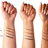 Three forearms with light, medium and deep skin tones show parallel brow-cream swatches from light brown through warm brown and grey-brown to dark brown. The shade labels are cut off at the left edge.