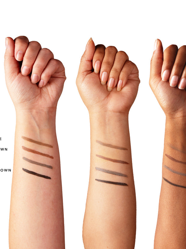 Three forearms with light, medium and deep skin tones show parallel brow-cream swatches from light brown through warm brown and grey-brown to dark brown. The shade labels are cut off at the left edge.