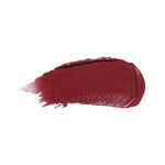 A horizontal swatch of Black Rose lipstick in deep burgundy, with a glossy surface and fine brush marks fading from one end.