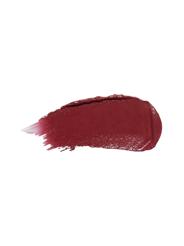 A horizontal swatch of Black Rose lipstick in deep burgundy, with a glossy surface and fine brush marks fading from one end.