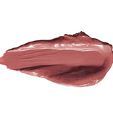 A thick smear of Buttercup lipstick in muted mauve pink, with a smooth glossy centre, raised creamy edges and a tapered end on white.