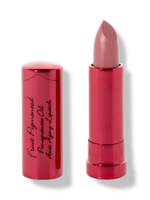 Buttercup lipstick with a slanted dusty rose tip extended from a metallic pink tube; its matching cap with black cursive lettering stands beside it.