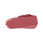 A horizontal swatch of Clover lipstick in dusty rose pink, with a softly glossy surface, a rounded end and fine brush marks at the opposite edge.