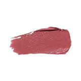 A horizontal swatch of Clover lipstick in dusty rose pink, with a softly glossy surface, a rounded end and fine brush marks at the opposite edge.