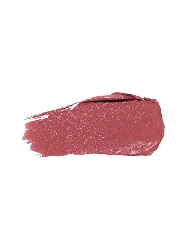 A horizontal swatch of Clover lipstick in dusty rose pink, with a softly glossy surface, a rounded end and fine brush marks at the opposite edge.