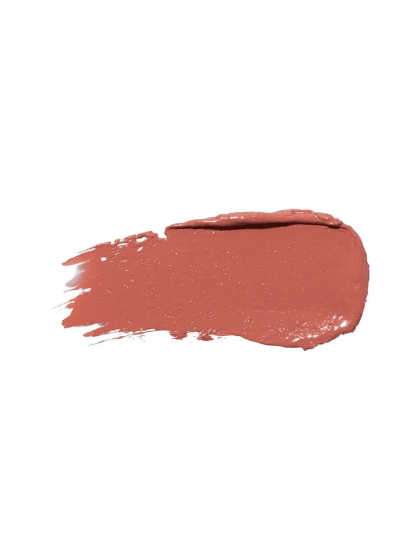 A horizontal swatch of Calendula lipstick in warm peach brown, with a softly glossy surface, a rounded end and fine brush marks at the opposite edge.
