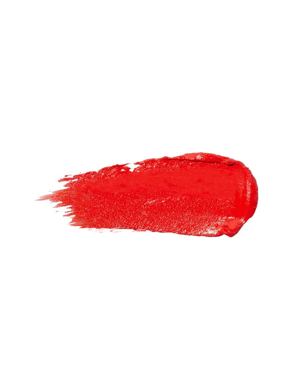 A horizontal swatch of Hibiscus lipstick in vivid orange red, with a glossy surface and fine brush marks fading from one end.
