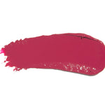 A broad swatch of Narcissus lipstick in deep fuchsia pink, with a smooth glossy surface and fine streaks at one end on white.