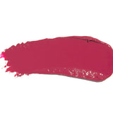 A broad swatch of Narcissus lipstick in deep fuchsia pink, with a smooth glossy surface and fine streaks at one end on white.