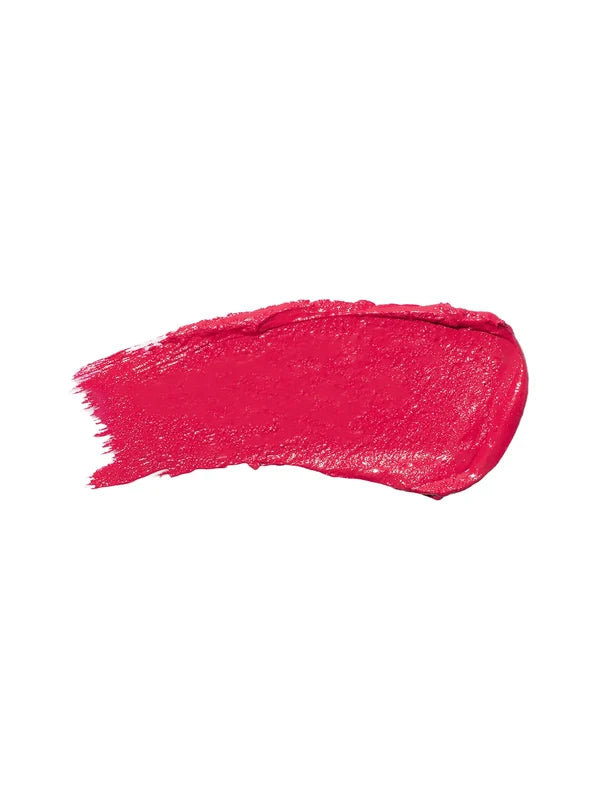 A horizontal swatch of Primrose lipstick in vivid magenta pink, with a softly glossy surface and fine brush marks along one end.