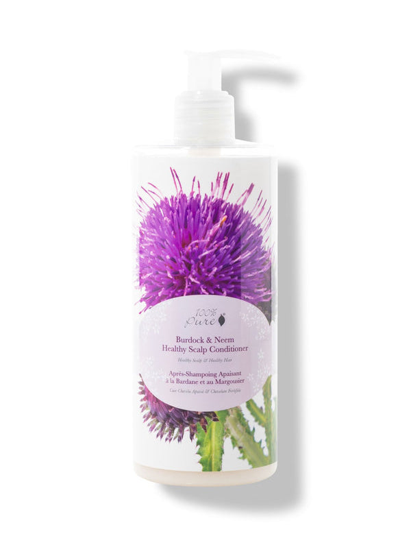 A white pump bottle of 100% Pure Burdock and Neem Healthy Scalp Conditioner has a large purple thistle and green leaves behind a pale pink oval label. The white pump points to the right.