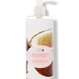 A white pump bottle labelled 100% Pure Honey & Virgin Coconut Restorative Shampoo has a large photograph of an opened coconut behind a pale pink oval label. Golden liquid is visible at the bottom.